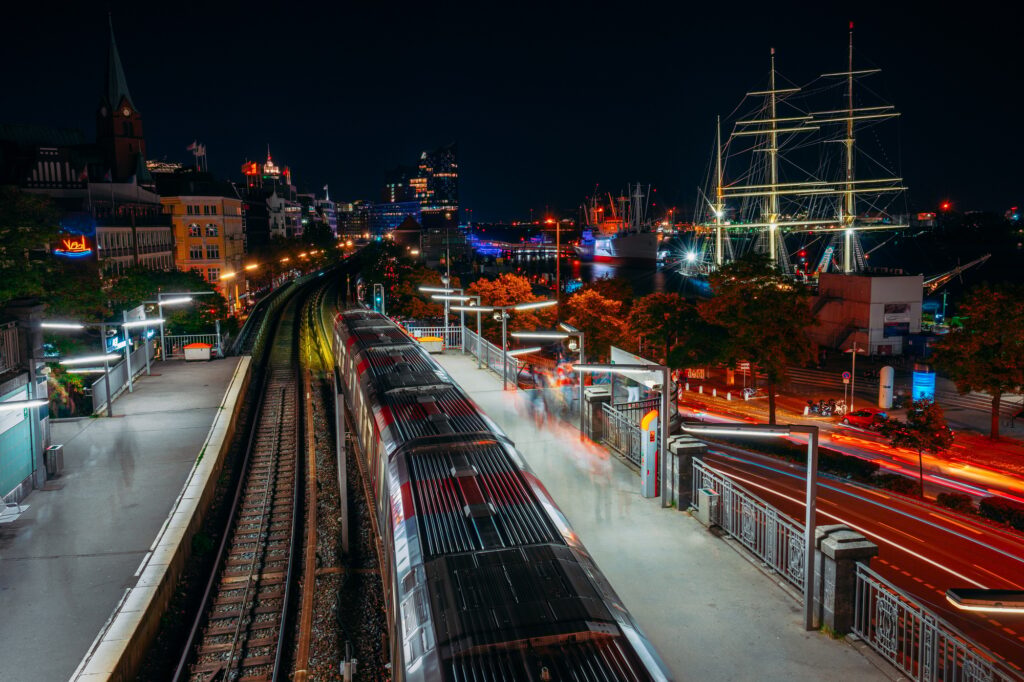 Landungsbruecken in Hamburg during night. Panorama of Harbor and metro station, Germany. Light