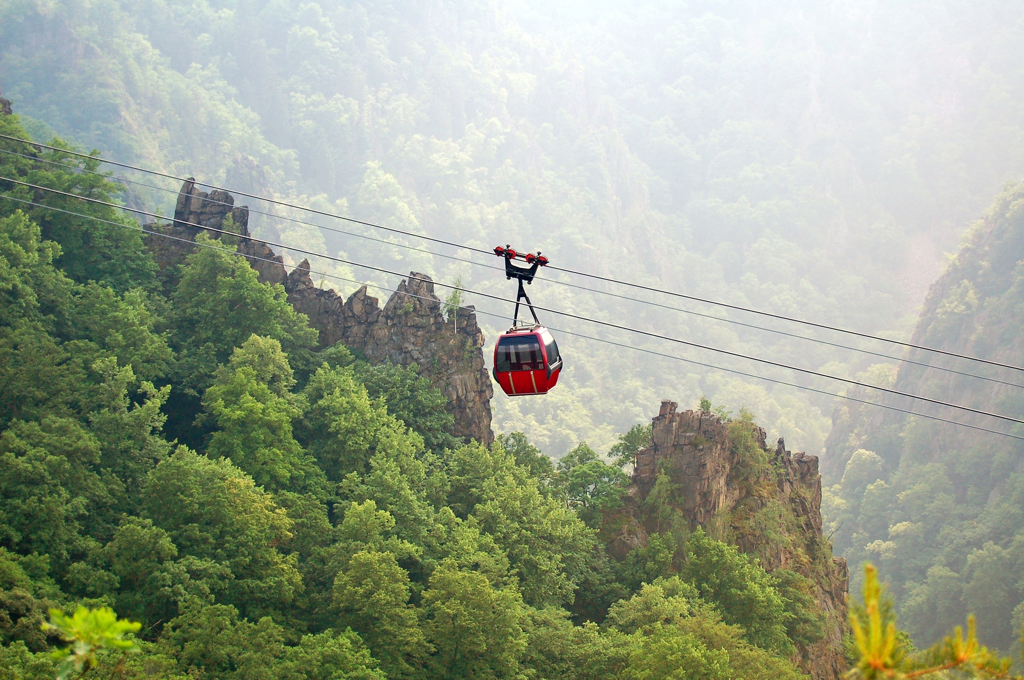 View into Bodetal valley at Harz mountains in Germany. next to village Thale. Cable car passing by