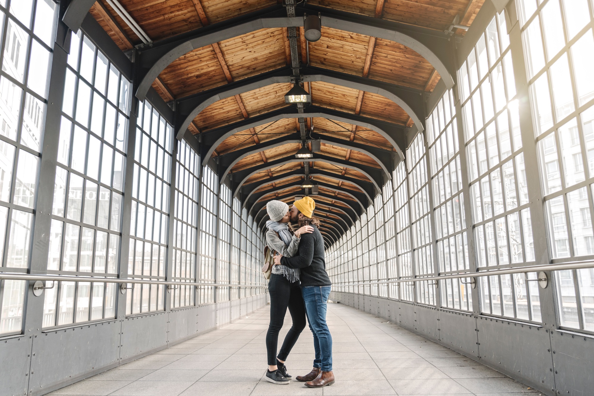 Young couple kissing at a subway station, Berlin, Germany